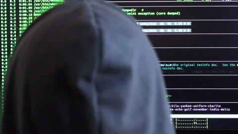 Extreme close back shot of a hacker looking at the code being executed Stock Footage 146607361