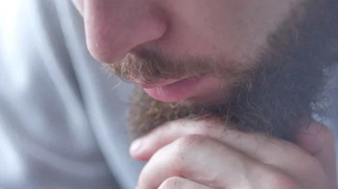 Extreme close up of a bearded man twirling his ridiculously long mustache Video stock 68754348