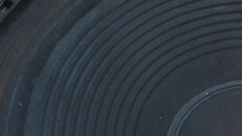 Extreme Close Up of a Black Ribbed Paper Subwoofer Speaker Cone Stock Footage 334108437