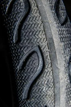 Extreme close-up of Black Rubber Small Wheel Sole Tread Pattern for Grip an.. Stock Photos
