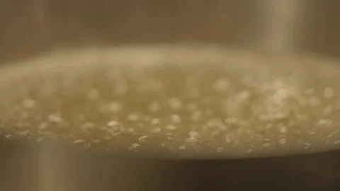 Extreme close-up of boiling water bubbles Stock Footage 336173914