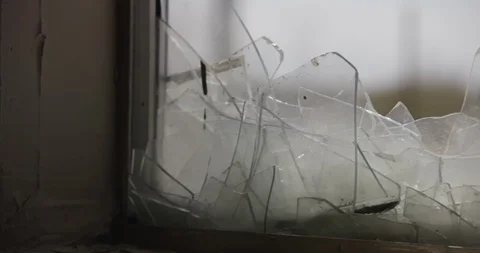 Extreme Close Up of Broken Window Glass - Pan Right Stock Footage 89942026