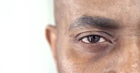 Extreme Close-Up of a Brown Eye of an Afro-American Man Stock Footage 63091999