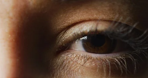 Extreme close up of a brown eye Stock Footage 99745081