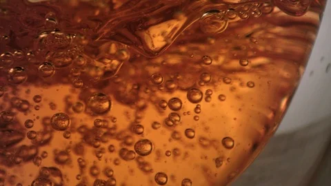 Extreme close-up of bubbles inside tea glass Stock Footage 99700984