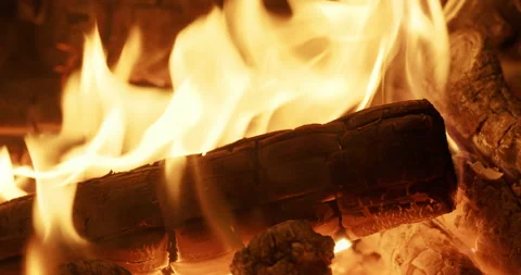 Extreme Close Up of Burning Firewood Flames Glowing Coals and Charred Wood Stock Footage 343538290
