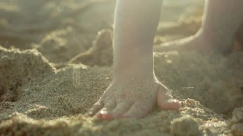 Extreme Close Up Of Child's Small Hand Patting Sand On The Beach Stock Footage 36871246