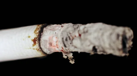 Extreme close up cigarette burning inhalation Stock Footage 45726564