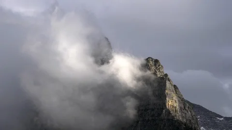Extreme close up of clouds lifting from mt oberlin in glacier np Stock Footage 94170918