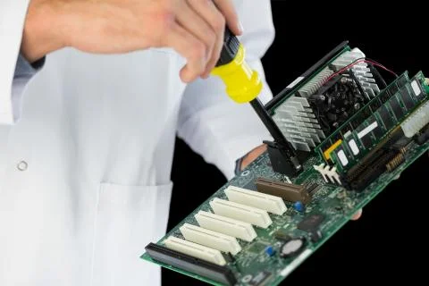 Extreme close up of computer engineer repairing hardware at night Stock Photos