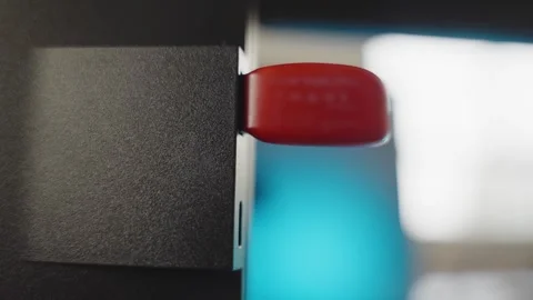 Extreme close up on computer as hand plugs memory flash drive and unplugs it Stock Footage 335241567