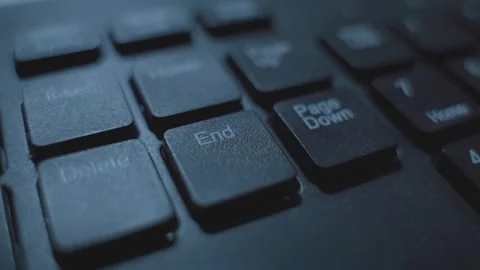 Extreme close up on computer keyboard End button being pressed by finger Vidéo 331216080