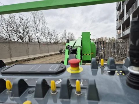 Extreme Close-up of Control Levers and Emergency Stop Button on Lift Stock Photos