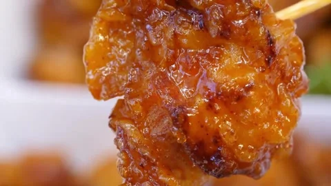 Extreme Close-Up of Crispy Fried Chicken Wing Coated in Spicy Buffalo Sauce Video stock 343027674