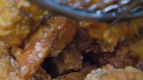 Extreme Close-Up of Crispy Japanese Fried Chicken Karaage Bites Video stock 343027170