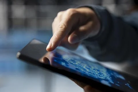Extreme close up of data center developer using device to do AI improvements 스톡 사진