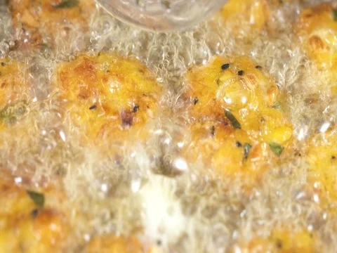 Extreme close up - Deep Frying Indian Pakoda Stock Footage 80451496