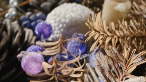 Extreme close-up detailed christmas composition with candles and dried pine Stock Footage 194506049