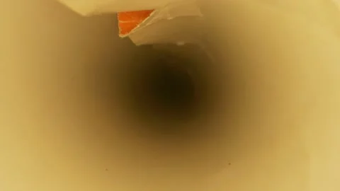 Extreme close-up, detailed. inside view of wrapping paper scroll Stock Footage 144433183