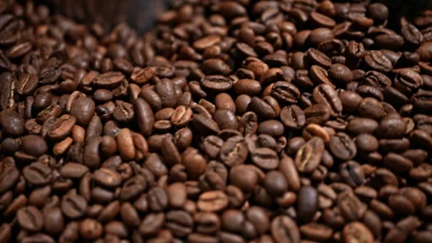 Extreme close-up detailed texture of roasted coffee beans. Stock Footage 327395559