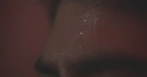 Extreme Close Up Of Dramatically Lighted Face, sweat dripping Stock Footage 161439469