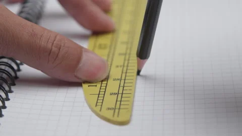 Extreme Close Up of Drawing a Straight Line with a Pencil and Ruler Stock Footage 337880762