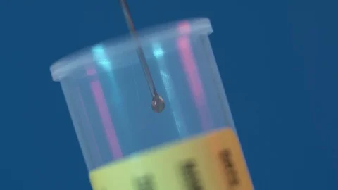 Extreme close up dropd from syringe Stock Footage 128343358