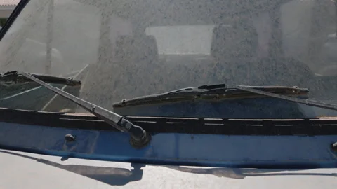 Extreme close-up of a dusty, weathered car window with faint reflections, Cote Stock-Footage 344828565