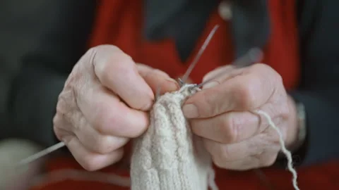 Extreme Close Up of Elderly Woman Hands Knitting Wool Socks 스톡 동영상 334106978