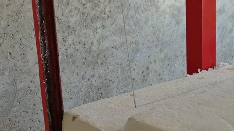 Extreme close up of electric cutter slicing EPS insulation board. Stock Footage 339612682