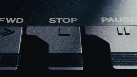 Extreme Close Up of Finger Pressing Stop Button on Retro Audio Deck Stock Footage 342452600