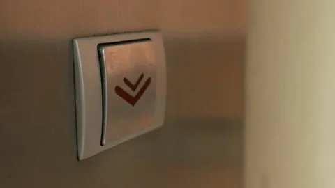 Extreme close-up of finger pushing downward elevator button Vídeo Stock 95238853