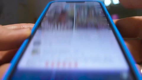 Extreme Close-Up of Finger Scrolling Through Social Network Feed Видео 265178535