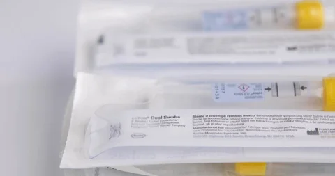 Extreme Close Up Focus Pull of Pile of COVID Swabs and Tubes Stock Footage 129415638