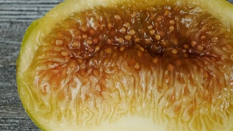 Extreme close up of fresh figs cut in half. Overhead slider shot. Stock Footage 113768700
