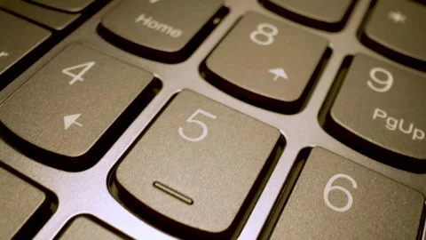 Extreme close up gliding shot of modern laptop keyboard keys Stock Footage 340902266