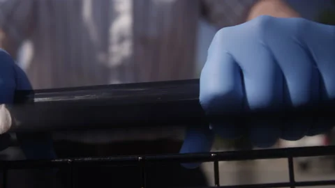 Extreme close-up of gloved hands pushing a shopping cart during a pandemic Stockbeeldmateriaal 130395177