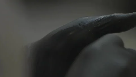 Extreme close-up of gloved hands shaping honey ball 库存影片 336374764