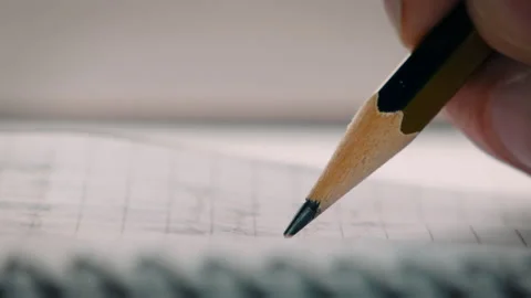 Extreme close-up of a graphite pencil writing Stock Footage 157059133
