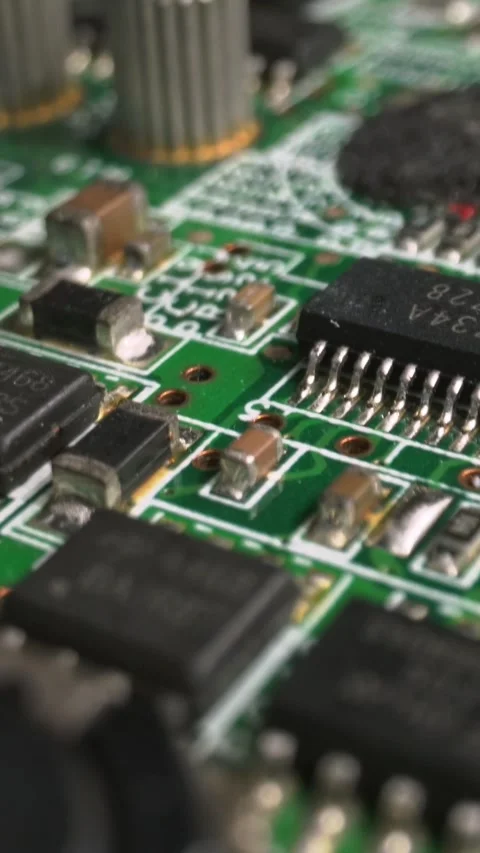 Extreme close-up of green Printed Circuit Board Electronics shot with dolly Stock Footage 286148420