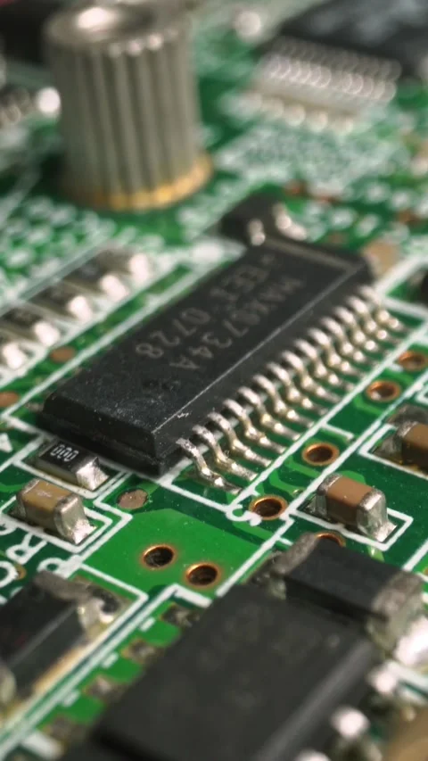 Extreme close-up of green Printed Circuit Board Electronics shot with dolly Stock Footage 290771563
