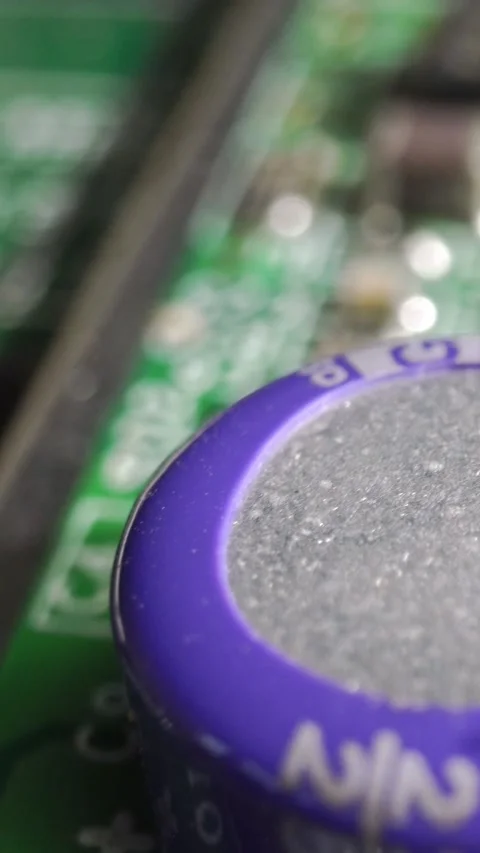 Extreme close-up of green Printed Circuit Board Electronics shot with dolly Stock Footage 290991528