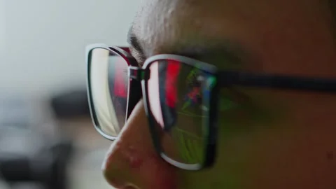 Extreme close-up of hacker or IT expert's eyes with digital security alert Stock Footage 328599673