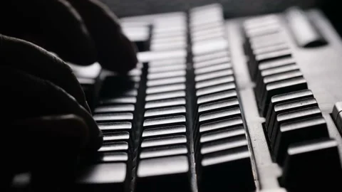 Extreme close-up of a hacker programmer's hand typing on a computer keyboard in Stock Footage 225162024
