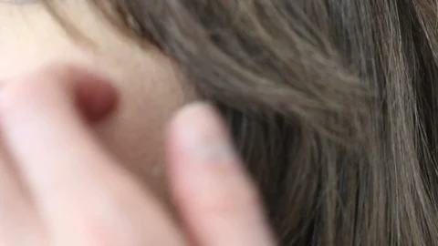 Extreme Close-Up of Hair Being Pulled Back to Show Ear (angle 2) Vidéo 87031157