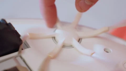 Extreme Close Up Hand Adjusting Robot Vacuum Side Brush for Proper Function 스톡 동영상 319914528