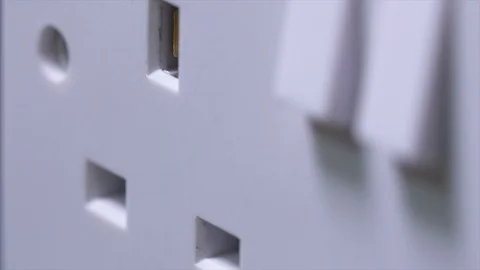 Extreme Close Up Of Hand Putting Uk Plug In Plug Socket And Taking Out The Plug Stock Footage 123064487