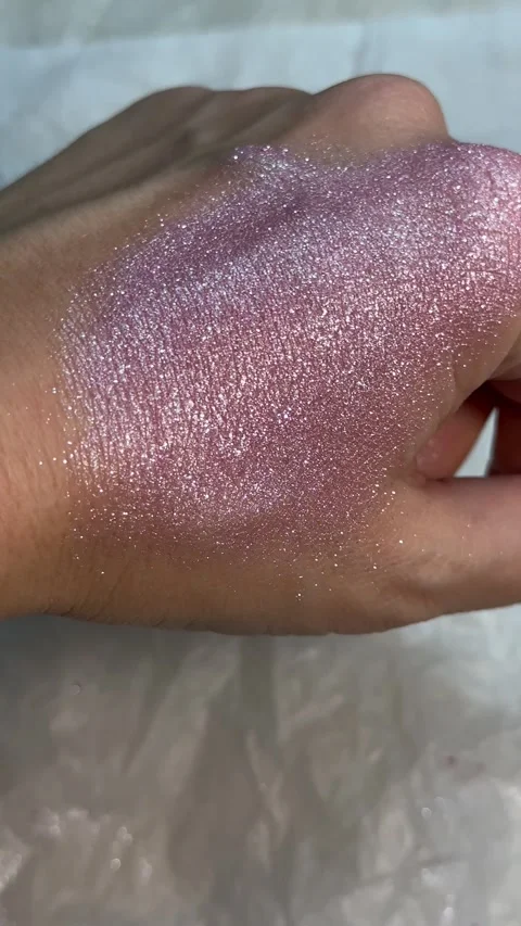Extreme Close-Up of Hand Spreading High-Shine Pink Glitter Cosmetic Stock Footage 321866278
