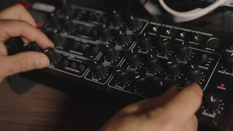 Extreme Close-Up of Hands on Behringer Pro-800 Synthesizer Controls Stock Footage 335161205