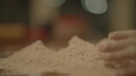 Extreme close-up of hands in flour 库存影片 336374682